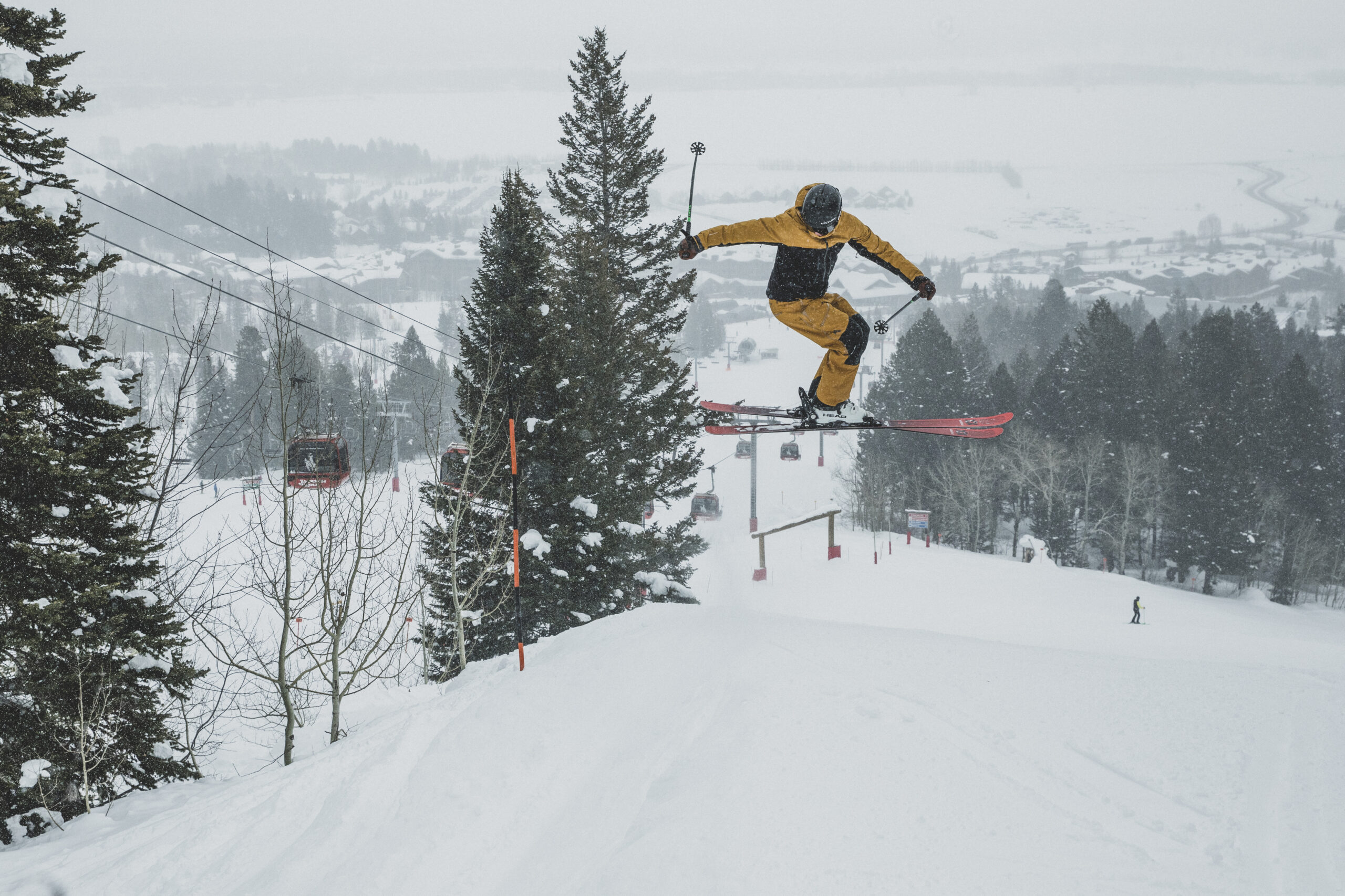 Skiers rotates in the air off a jump